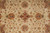 Close-up of allover design with rust palmettes, burgundy rosettes and soft green leaf accents