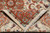 Folded corner showing dense knotting, firm cotton foundation edge and clean cream fringe ends