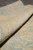Rolled edge showing low wool pile depth and tightly woven reverse of this Ziegler