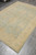 6x8 teal and gold Ziegler rug viewed diagonally, showing the full all-over floral layout