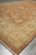 Low angle corner shot of neutral Chobi rug showing border depth and clean selvedge