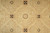 Macro detail of beige and sage wool pile with brown cross and star motifs