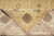 Folded corner revealing tight cotton foundation and crisp knotting behind the wool pile