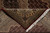 Folded corner revealing dense hand-knotted back, cotton fringe and ivory sage border detail