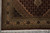 Corner detail with ivory sage guard borders, cotton fringe and black stepped spandrel