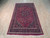 5'10" x 10' Persian Mashad rug on light oak floor showing full floral field