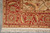 Corner detail of 5'7" x 5'10" Oushak square rug with coral border and plush fringe