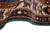 Curled edge detail of ivory main border, navy guard stripe and green overcast selvage stitching