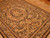 Angled view of 6x9 Chinese needlepoint rug with flat wool surface and all-over florals