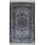 Ivory silk Oriental rug with navy floral medallion and green borders shown on white studio background