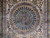 Close-up of blue central medallion with 8 petal rosette, rose and gold floral tracery