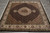6'5" x 6'8" square Indian Oriental rug angled on grey floor showing herati field and medallion