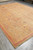 10'2" x 13'8" Indian Agra rug angled in warehouse showing full all-over floral field