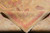 Folded corner of the Agra rug showing cotton foundation, back weave and hand-tied fringe