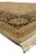 Side view of beige field meeting black border, camel guard stripes and thick fringe