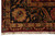 Border corner close-up with camel guard stripe, black ground palmettes and multicolored floral detail
