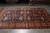 Dim showroom view showing blue lattice field and wide apricot main border end to end