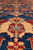 8x13 Pakistani Kazak rug field detail with gold palmette and red hooked leaves on blue