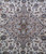 Close-up of beige medallion core with navy outlines, olive rosette and pale blue palmettes