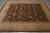 Ivory outer border and gold guard stripes frame the brown field of this 8x10 rug