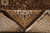 Folded corner revealing dense hand-knotted pile, cotton fringe and gold inner border leaf motifs
