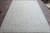 Full daylight view of this hand-knotted 9x12 light blue and ivory Peshawar rug