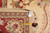 Back of 10'1" x 13'8" Pakistan rug with tag F-4276 and tape measure