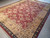 9x12 hand-knotted Indian wool rug at an angle, suited to a large living room setting