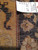 Reverse side with original tag reading rug number 5582, size 8.10 by 11.9, hand woven