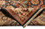 Folded corner revealing tight cotton foundation and even knotting on the back of the wool rug