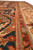 Low angle along the guard stripes showing rust, sage and ivory border banding detail