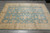 9x12 Chobi area rug from Pakistan displaying all-over palmette and vine field design