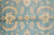 Close-up of field design with ivory palmettes, paisley boteh motifs and curling serrated leaves