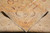 Folded corner revealing cotton foundation, even hand-knotting and the tightly woven back of the rug