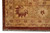 Corner detail with gold border, rust guard stripe, rosette minor border and hand-tied fringe