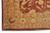 Border corner of rust and camel Oriental rug showing serrated leaves and rosette motifs