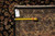 Back of rug with tape measure and tag reading genuine hand woven Oriental rug PIX-5278