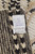 Back tag noting hand-knotted in Pakistan, 100% natural wool, Moroccan pattern, size 11'3 x 7'11