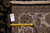 Back tag reading size 8.1 x 10.1 beside tape measure on the ivory border