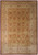 Overhead view of gold field Oriental rug with rust palmettes and ivory multi-border