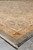 Corner perspective showing layered borders, grey selvage edge and hand-tied fringe on wool rug