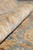 Rolled edge showing the fine hand-knotted back and dense natural wool pile in gold