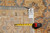 Back tag reading rug F-4259 size 9.2 by 11.8 beside measuring tape for scale
