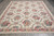 Room size 9x12 flat weave tapestry rug showing rose garlands and ivory floral border