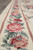 Rose garland border detail framed by dusty rose guard stripes and plain ivory outer edge