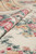 Rolled fold showing dense wool stitching, flat tapestry surface and no pile height