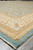 Angled corner view of aqua blue Chobi rug with layered gold and ivory borders
