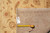 Reverse side with dealer tag F-4482 and tape measure confirming the 8' x 10'4" size
