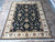 8' x 10'2" hand-knotted Indian wool rug shown full length with inventory tag number 6278 visible