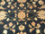 Centered lotus rosette and blossoms on black ground, knot detail of fine hand-spun wool pile